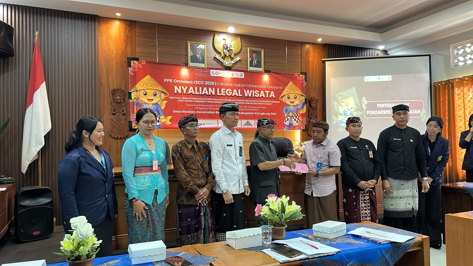 “Seremonial Penyerahan SK Pokdarwis Dewi Nyalian dan Musyawarah Desa”